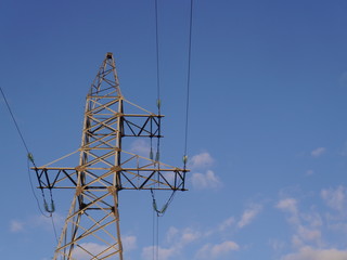 High voltage towers against the sky