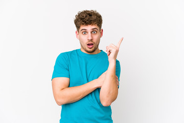 Fototapeta premium Young blond curly hair caucasian man isolated having some great idea, concept of creativity.