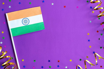 Indian Independence Day. India flag on festive purple background. The concept of celebration, patriotism and celebration. Copy space, flat lay