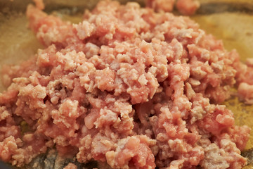 Cooking chicken mince in pot 