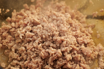 Cooking chicken mince in pot 