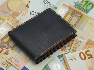 Black leather wallet with euro banknotes