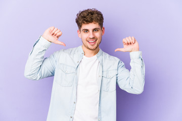 Young blond curly hair caucasian man isolated feels proud and self confident, example to follow.