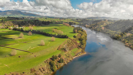 Fototapeta na wymiar New Zealand aerial view. Meadows and river