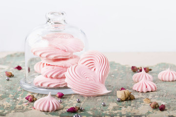 Yogurt glazed strawberries and heart shaped meringues