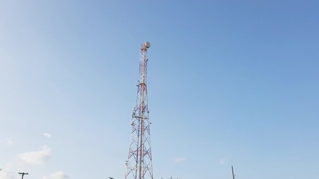 Telephone signal antenna with beautiful blue sky background.