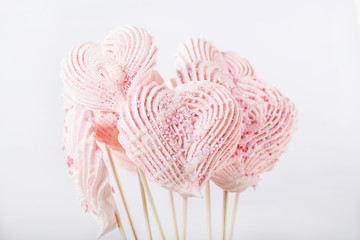 Yogurt glazed strawberries and heart shaped meringues