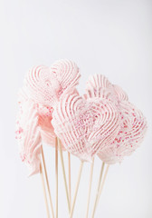 Yogurt glazed strawberries and heart shaped meringues