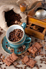  Fresh coffee bean in coffee bean grinder on wooden  background