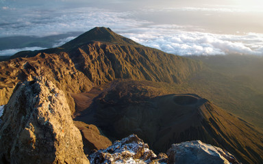 Mount Meru and its ash cone above clouds. Arusha  Tanzania. Africa. 