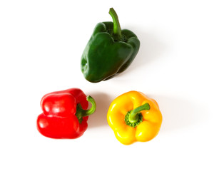 Three colorful bell peppers isolated on white background.