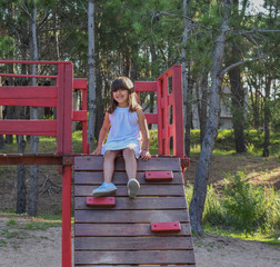 A little happy girl playing