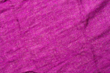 Fototapeta na wymiar Background of crumpled fabric of fuchsia color