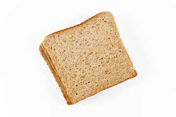 Top view of slices of wholegrain spelt wheat toast bread on white background