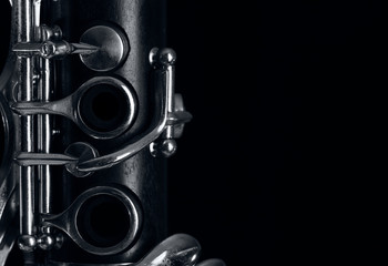 clarinet body on black background - obrazy, fototapety, plakaty