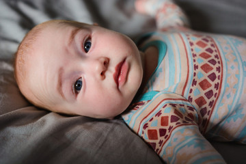 Cute young boy laying on the bed