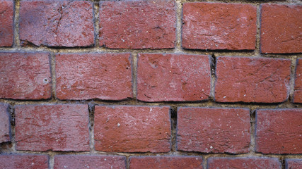 muro di mattoni rossi con la fuga nera per sfondo o frattale trama parttern