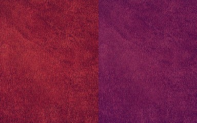 The texture of natural suede. Purple background of leather material.