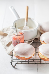 Closeup of delicious and sweet donuts on cooling grate