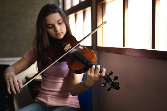Teenage musician rehearsing
