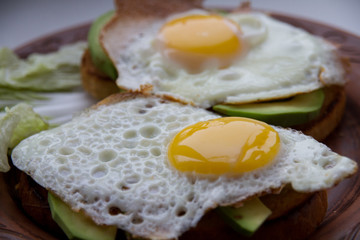 Toast with fried egg on a blurry background