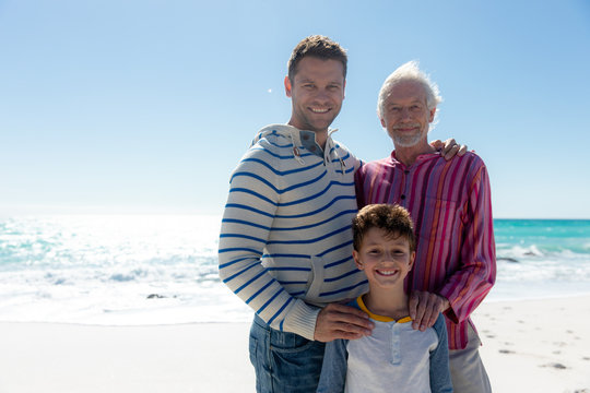 Grandfather Father And Son At The Beach