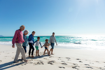 Family walking together at the beach