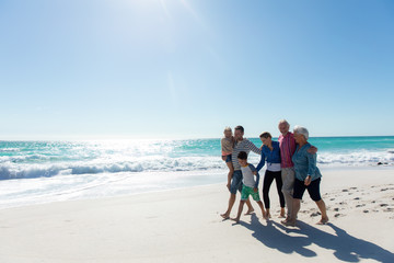 Family walking together at the beach