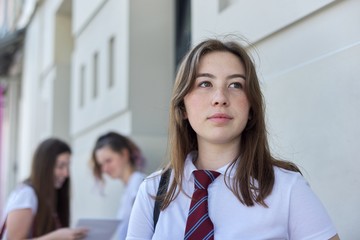 Closeup outdoor portrait of teenage student of 17 years old
