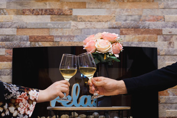 Couple celebrating with white wine.