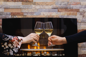 Couple celebrating with white wine.
