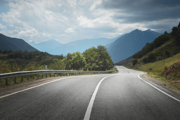 Country road to mountains. Travel