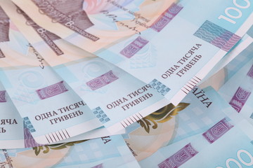 Ukrainian hryvnia, several banknotes of 1000 hryvnias. Financial background from Ukrainian banknotes. Money background. Close-up