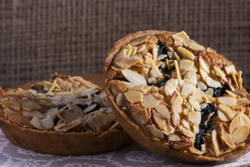 Homemade Almond cookies on wooden table background on napkin, Healthy cookies with prunes and almonds.