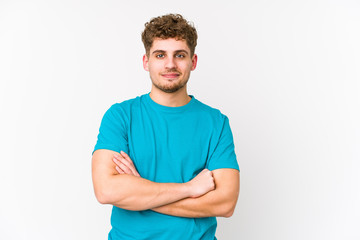 Fototapeta premium Young blond curly hair caucasian man isolated laughing and having fun.