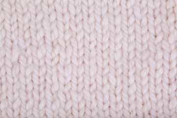 Knitted texture, woolen product, homework, hobbies, knitting, needlework. Close-up, background