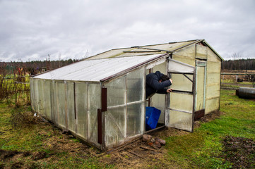Homeless migrant refugees in temporary shanty houses in the field. Social problems. Minsk Belarus...
