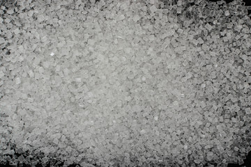 Plastic in granules on black background close up