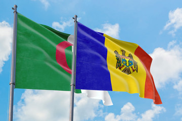 Moldova and Algeria flags waving in the wind against white cloudy blue sky together. Diplomacy concept, international relations.