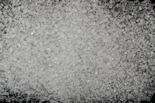 Plastic in granules on black background close up