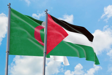 Palestine and Algeria flags waving in the wind against white cloudy blue sky together. Diplomacy concept, international relations.