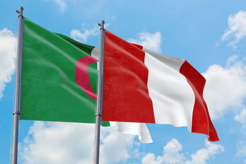 Peru and Algeria flags waving in the wind against white cloudy blue sky together. Diplomacy concept, international relations.