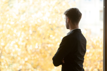 Boss looking to autumn scenery feels satisfied with successful workday