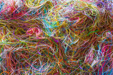 Multi-colored tangled threads abstract texture pattern background. Macro shot of colorful...