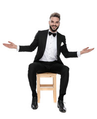 businessman sitting and greeting with open hands