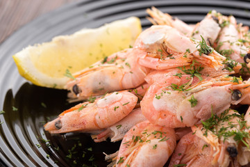 Shrimp on a plate Seafood, shelfish. Shrimps with herbs, garlic and lemon. Sea Food.