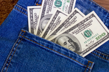 Money in the pocket of jeans. United States dollars