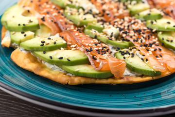 Salmon and Tortilla Appetizer. smoked salmon and cream cheese on plate. Smoked Salmon cream cheese pizza