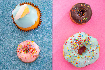 Donuts and cupcake isolated on colorful background