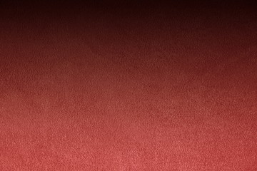 The texture of natural suede. Purple background of leather material.